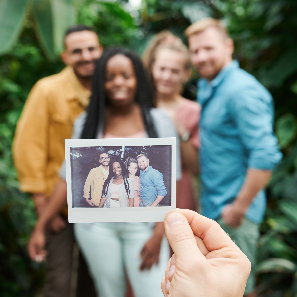 photo of four friends having their photo taken